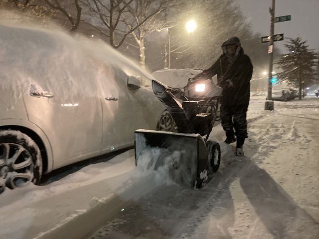 Pablo Castillo, a super at a building in Harlem, plows the sidewalk the morning of January 29th.